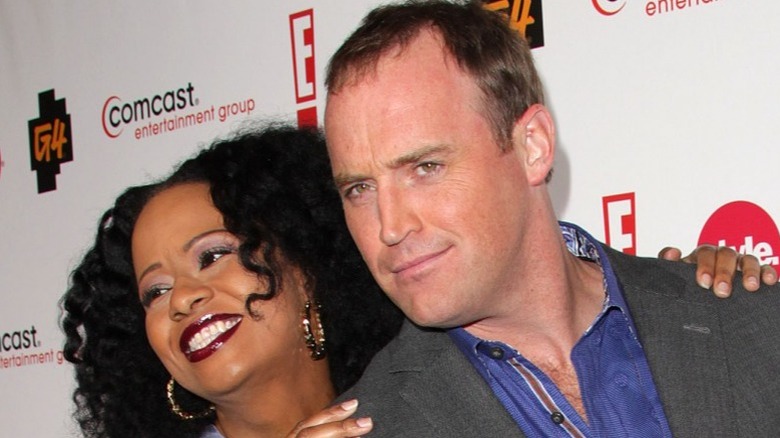 Tempestt Bledsoe and Matt Iseman posing on red carpet