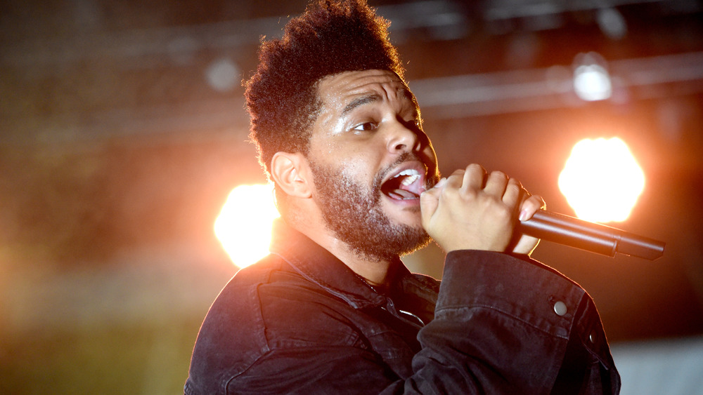 The Weeknd performing onstage in 2018