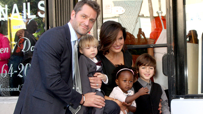 Peter Hermann and Mariska Hargitay posing with their three kids