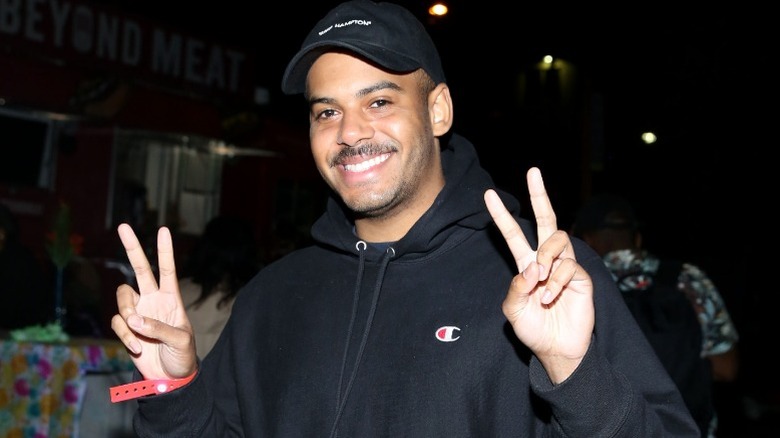 Zack Fox flashes double peace signs