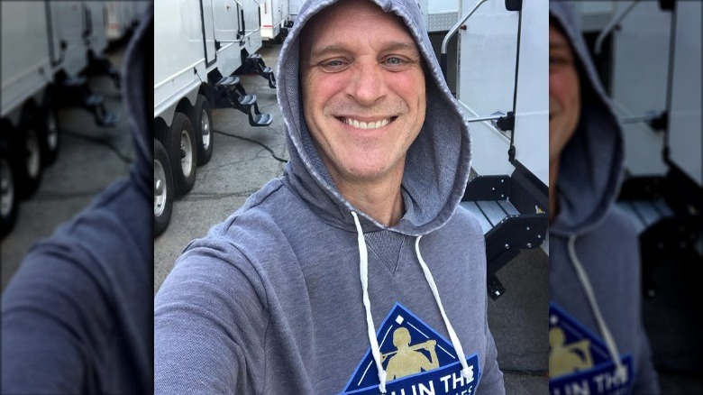 Randy Flagler smiling by set trailers