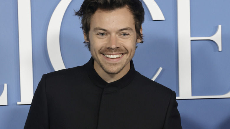 Harry Styles posing for a photo at a premiere
