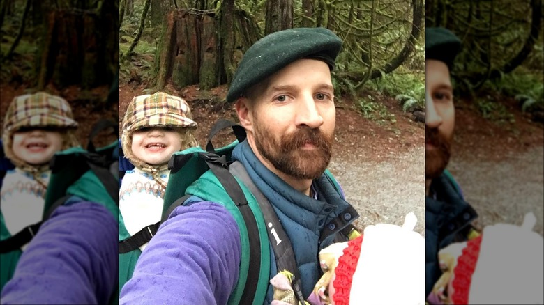 Cole Maness carrying daughter on back