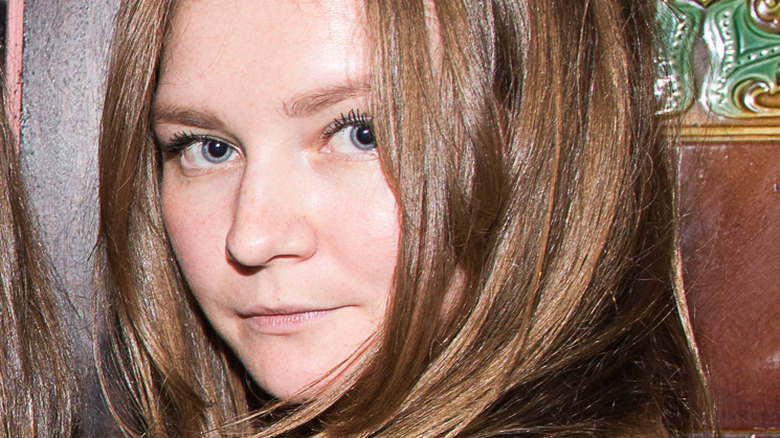 Anna Delvey poses in 2014