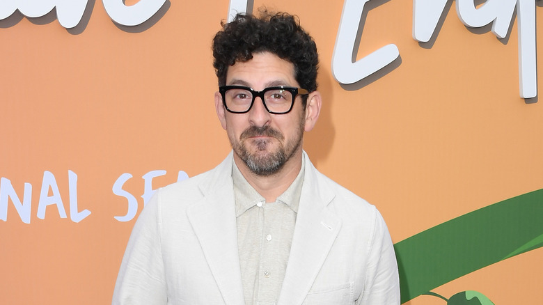 Adam Shapiro wearing black glasses