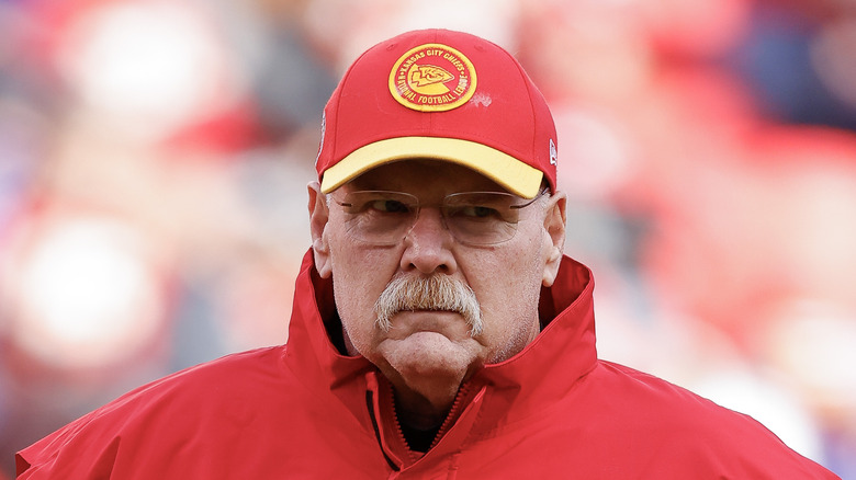 Andy Reid stands on the field