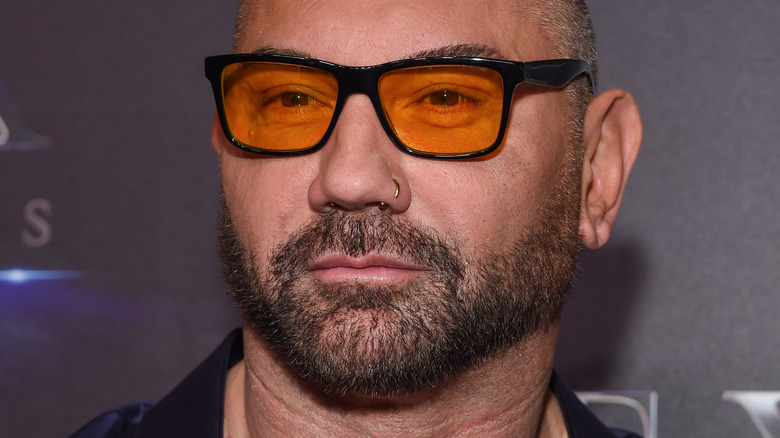 Dave Bautista wearing orange-tinted sunglasses