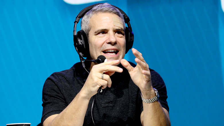 Andy Cohen speaking onstage