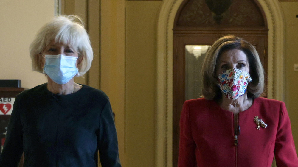 Lesley Stahl and Nancy Pelosi walking together