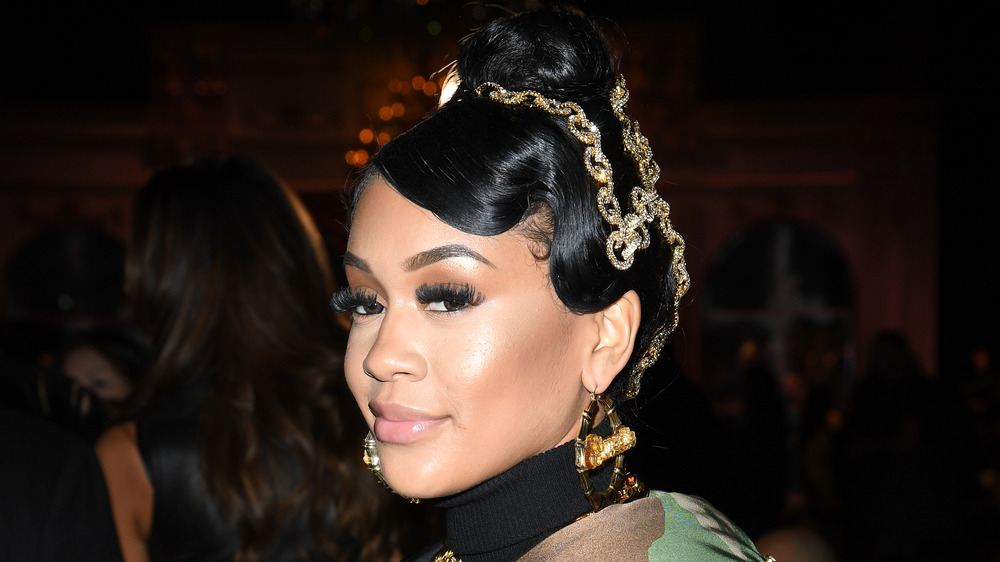 Saweetie sports an updo and a smile