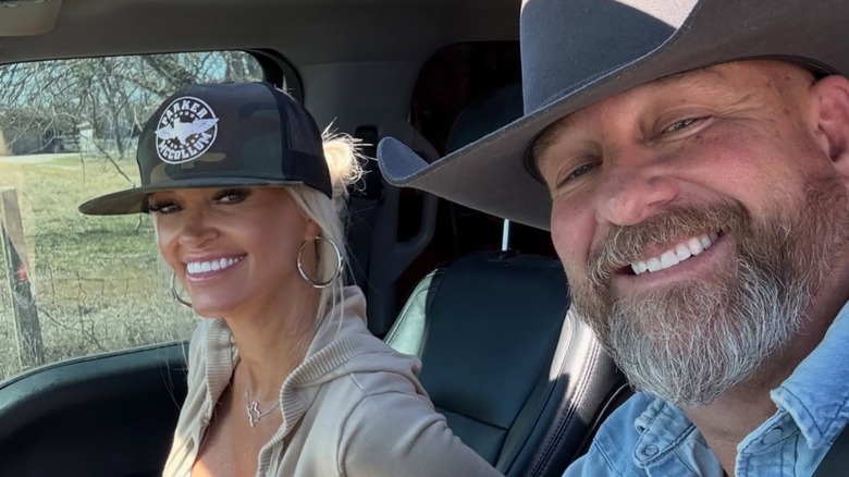 Brandon and Tina Hatmaker sport wide smiles in a car selfie
