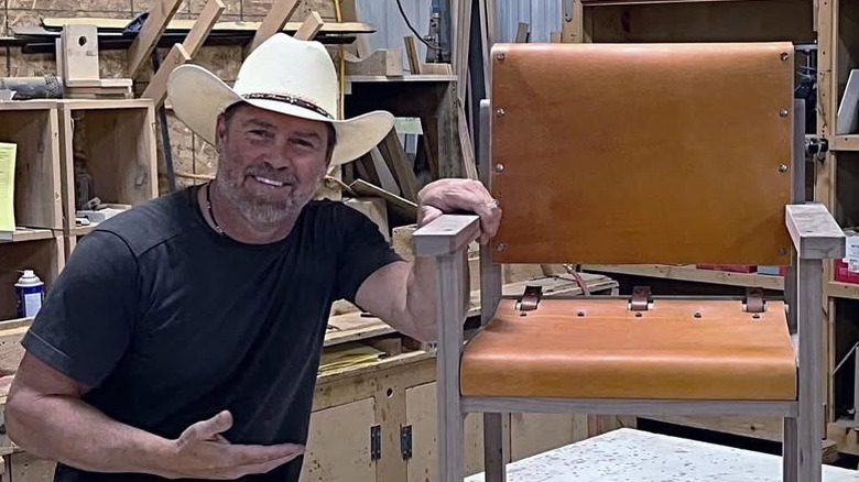 Tim McClelland posing with self-made chair