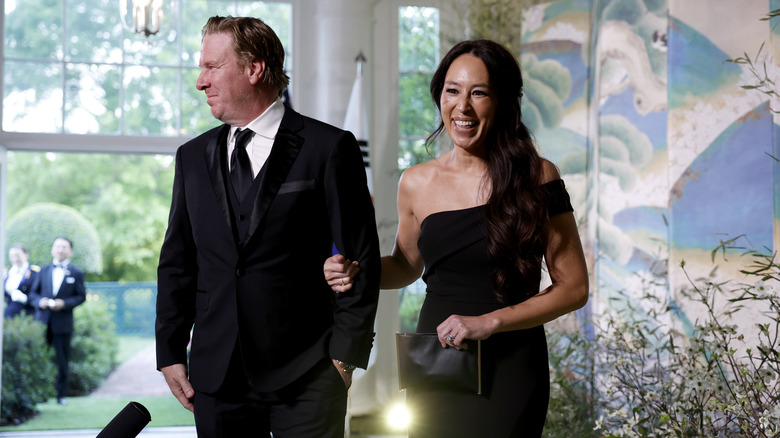Chip and Joanna Gaines dressed in formal black attire for the White House state dinner.