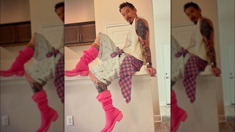 David Bromstad posing on a countertop.