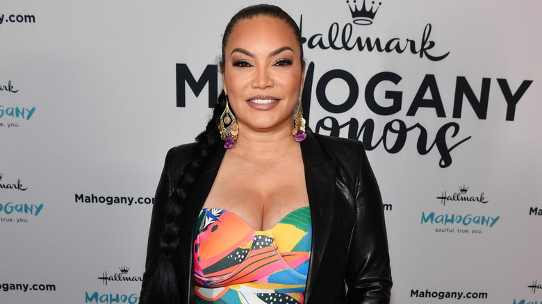 Egypt Sherrod smiling in black leather blazer