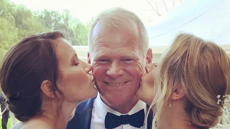 Mike Holmes' daughters kiss him on the cheeks