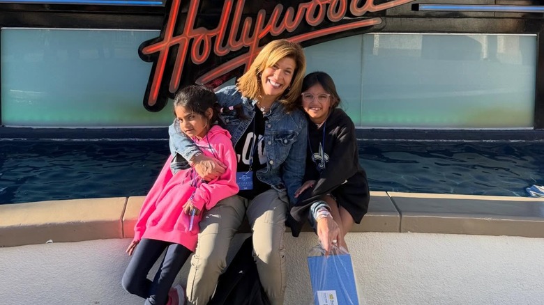 Hoda Kotb smiling, posing with daughters