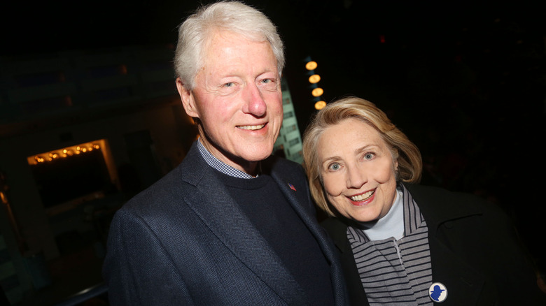 Bill Clinton and Hillary Clinton smiling