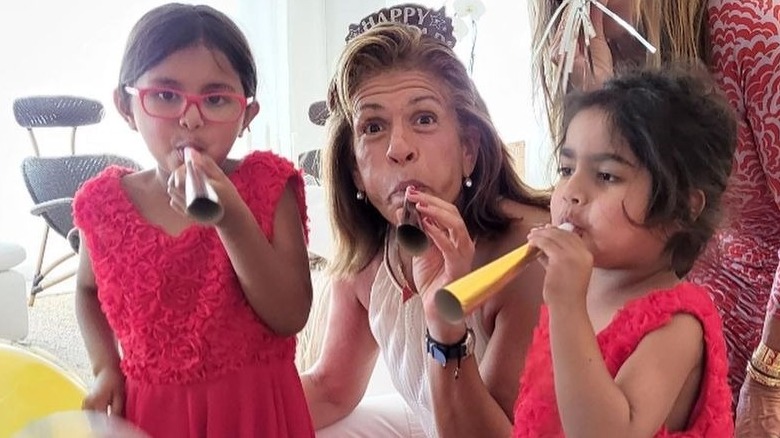 Hoda Kotb and her daughters posing for a picture