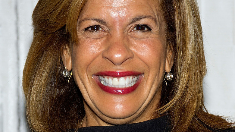 Hoda Kotb smiles in a black dress