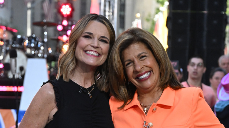 Savannah Guthrie and Hoda Kotb smiling while posing together