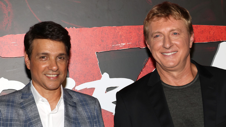 Ralph Macchio and William Zabka smiling
