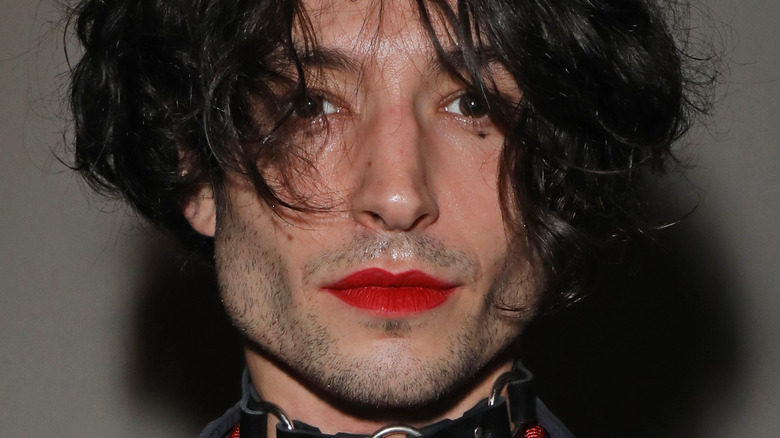 Ezra Miller wearing red lipstick