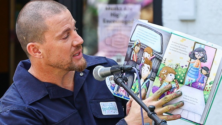 Channing Tatum reading a book on stage