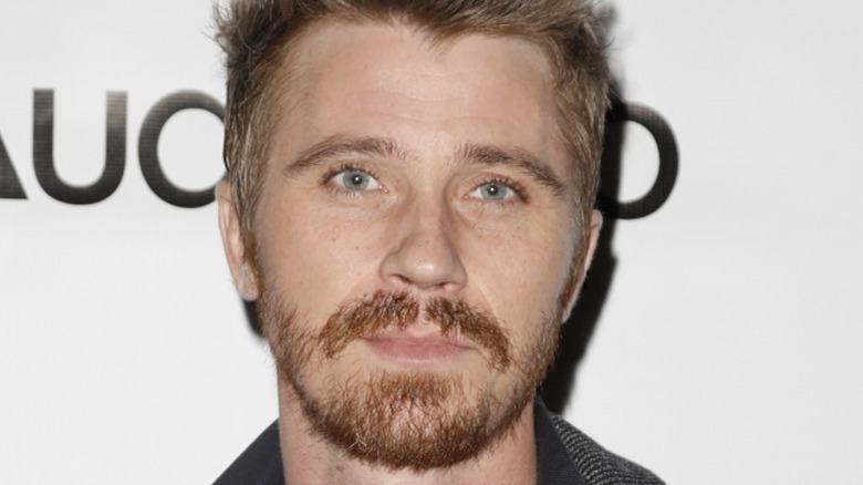 Garrett Hedlund posing at an event