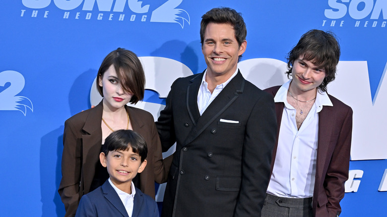 James Marsden posing with his three kids at a movie premiere 