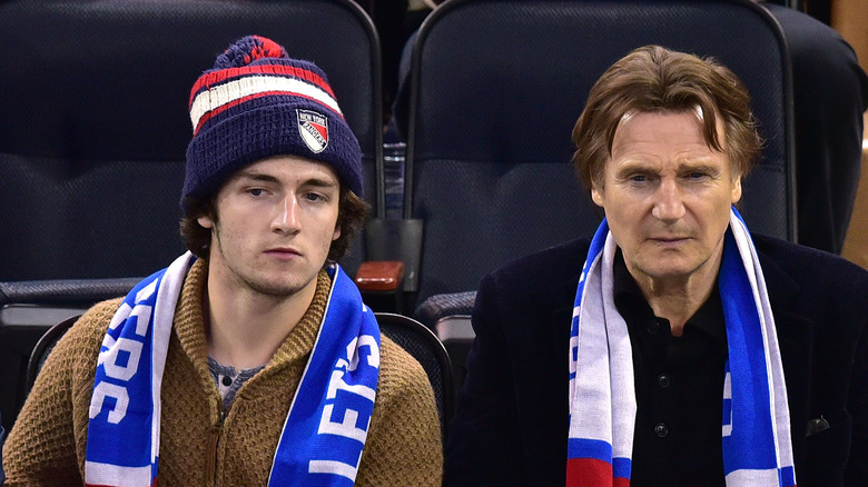 Liam Neeson and Daniel Neeson at a hockey game