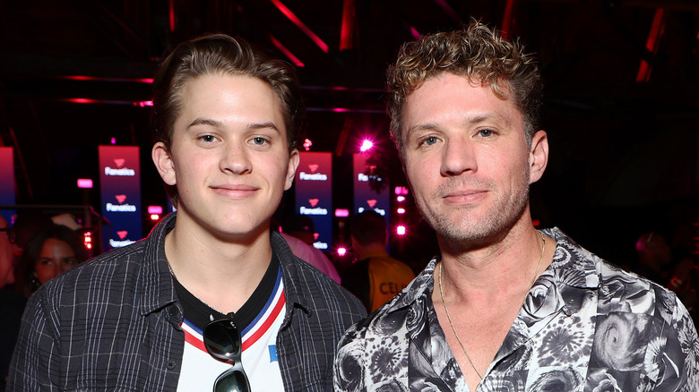 Ryan Phillippe and Deacon Phillippe posing at an event