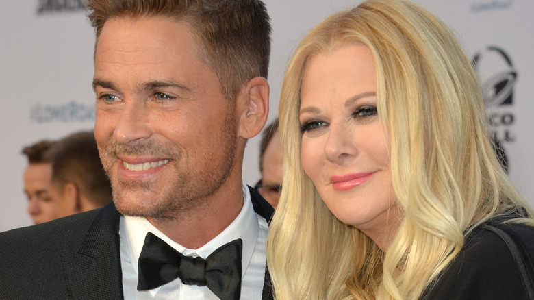 Rob Lowe and his wife Sheryl Berkoff posing and smiling together