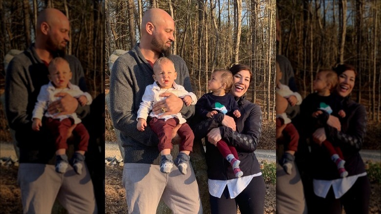 Hope Solo and Jerramy Stevens pose with their sons