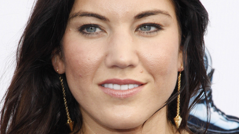 Hope Solo poses in drop gold earrings
