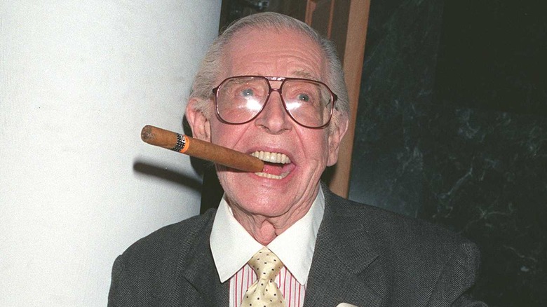 Milton Berle with a cigar in his mouth