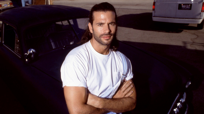 Lorenzo Lamas posing in the early 1990s in a white T-shirt