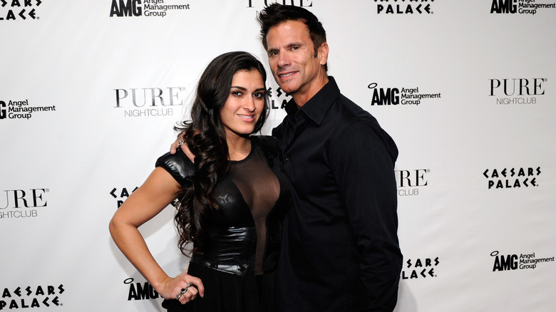 Lorenzo Lamas posing with his fifth wife Shawna Craig in all-black outfits