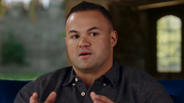 Patrick Mendes speaking in a confessional for 