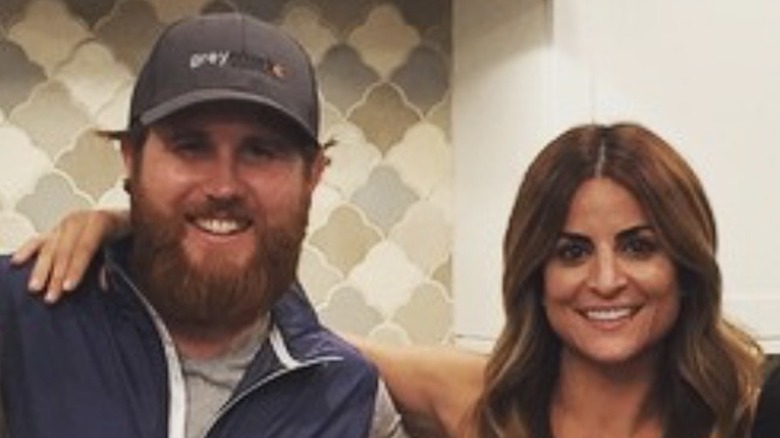 Donovan Eckhardt posing and smiling with Alison Victoria in a kitchen