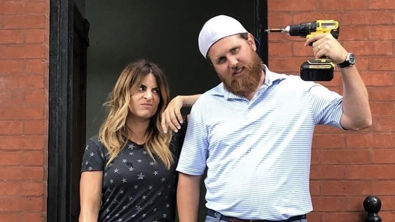 Alison Victoria posing with Donovan Eckhardt outside a doorway