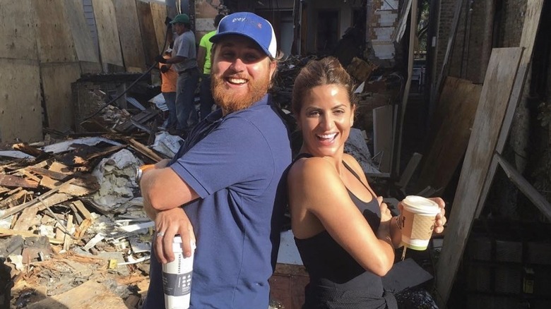 Donovan Eckhardt and Alison Victoria posing together on a work site