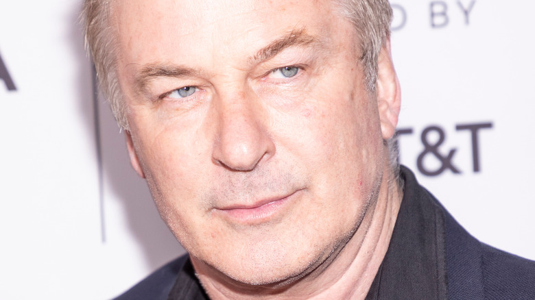 Alec Baldwin scowls on the red carpet