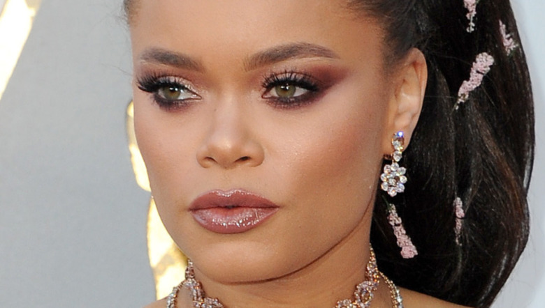Andra Day looking to the side while posing on the red carpet