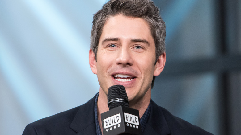 Arie Luyendyk Jr. with microphone