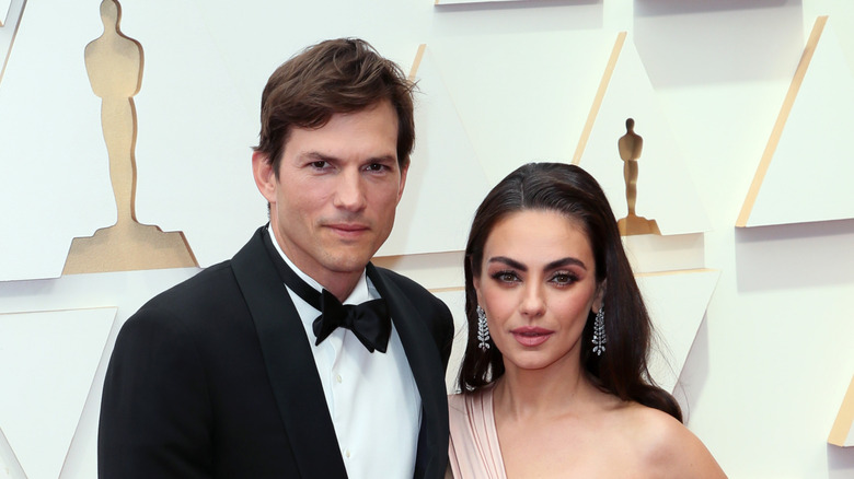Ashton Kutcher and Mila Kunis pose