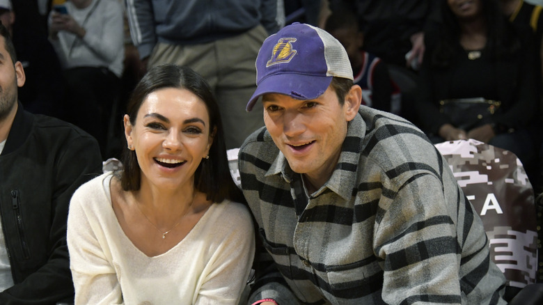 Ashton Kutcher and Mila Kunis smile