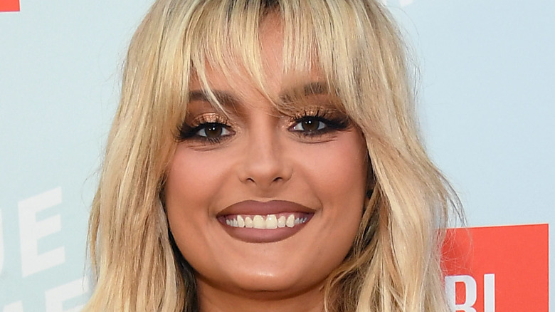 Bebe Rexha smiling on the red carpet