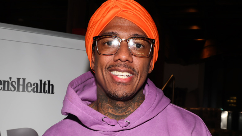 Nick Cannon orange hat 