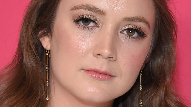 Billie Lourd with a serious expression